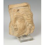 Relief with Apollo; Rome, Imperial period, 2nd-3rd century ADCarved marble.Size: 24 x 21 x 7 cm.
