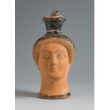 Figurative oinochoe. Attic Greece, 4th century BC.Ceramics.Provenance: German private collection.