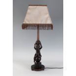 Table lamp from the first half of the 20th century.Carved and polychrome wood. Parchment lampshade.