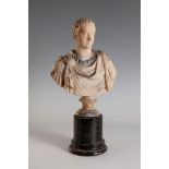 Bust of a Roman emperor, 19th century.Alabaster sculpture on a veined marble base.It shows some