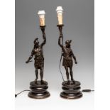 Pair of early 20th century lamp feet.Patinated bronze.Measurements: 41 cm (sculpture) + 10 cm (