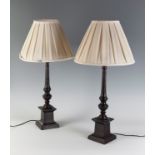 Pair of table lamps, late 19th - early 20th century.Black patinated bronze. Shades in pleated