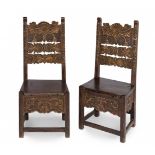Pair of Castilian chairs, XVIII century.Chestnut wood carved and polychromed.Use marks.Measurements: