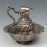 Aguamanil; Spain, 1860.Silver.With slight dents.It has punches.Measurements: 29 x 24 x 19 cm; 12 x