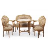 Set of two armchairs, two chairs, a triplet and a Louis XVI table, second half of the eighteenth