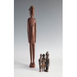 African school, 19th and 20th century.Four wood carvings.The little ones are wearing original