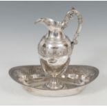 Silver ewer and basin. Empire style with decoration of winged lions and lyres on the eaves of the