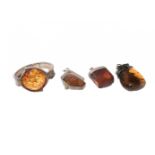 Set of three amber pendants and bracelet. Pendants with silver frames and silver clasps. Bracelet