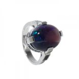 Ring in 18kt white gold. Model with cabochon-cut opal weighing ca. 8.32 carats. and border of