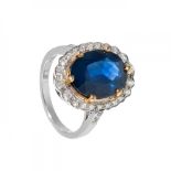 Ring in 18kt white gold. Oval rosette model with blue sapphire weighing ca. 7.00 carats. and a