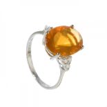 Ring in 18kt white gold and fire opal. Solitaire model with a fire opal weighing ca. 3.5 carats. and