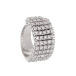 Skirt style diamond pinky ring in 18 kt white gold, with 16 diamond strips, 8 of them with movement.