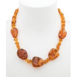 Amber necklace. Model with amber beads and five drop-shaped interpieces also in amber. Amber