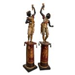 Pair of Venetian torchbearers, late 19th century.Carved, polychromed and gilded wood.Electrified for