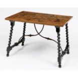 German table, 17th century.Cabinet front adapted to table top.Ebonised legs.Iron fasteners.