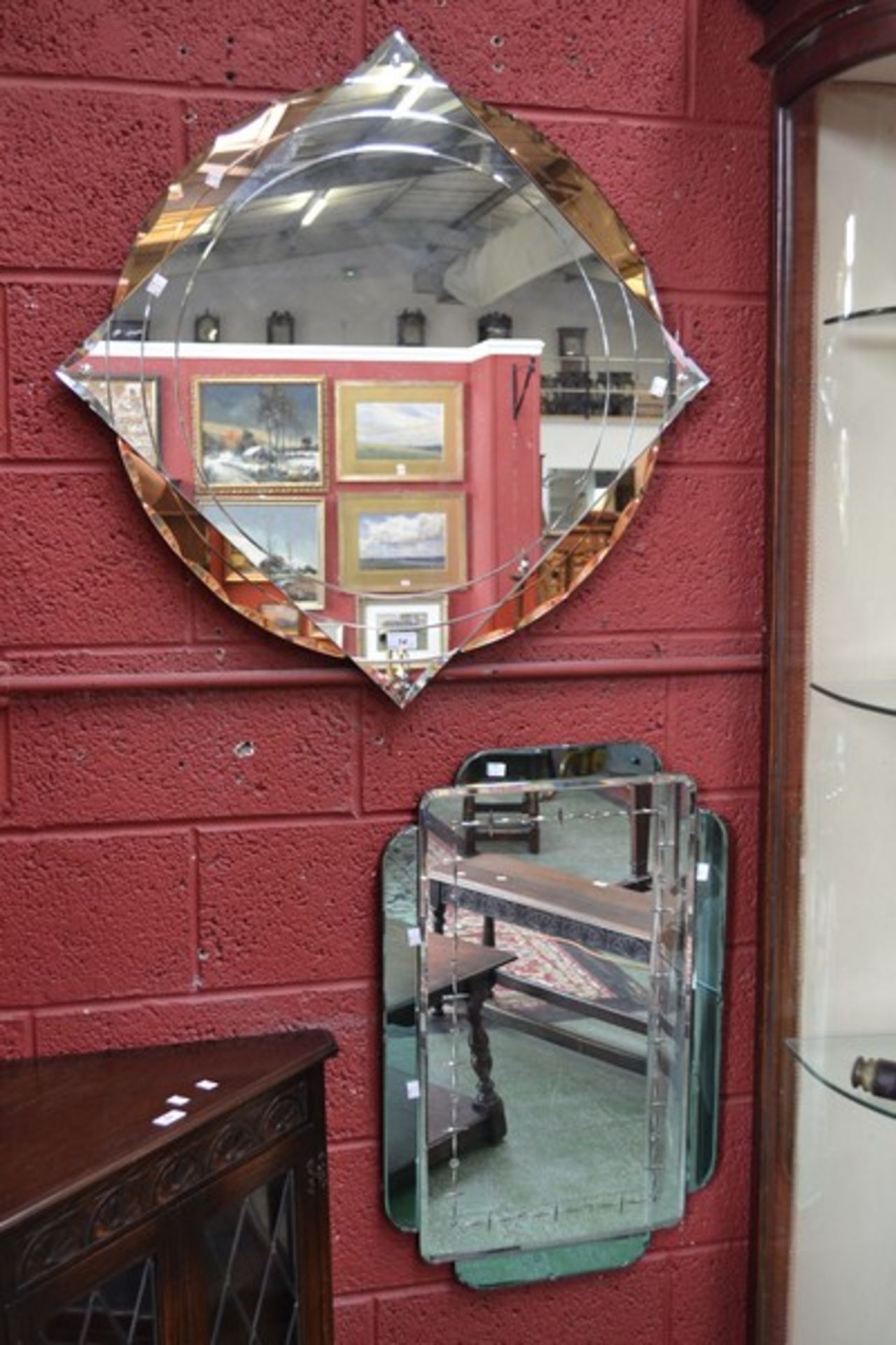 An Art Deco target bevelled mirror; another, rectangular (2)