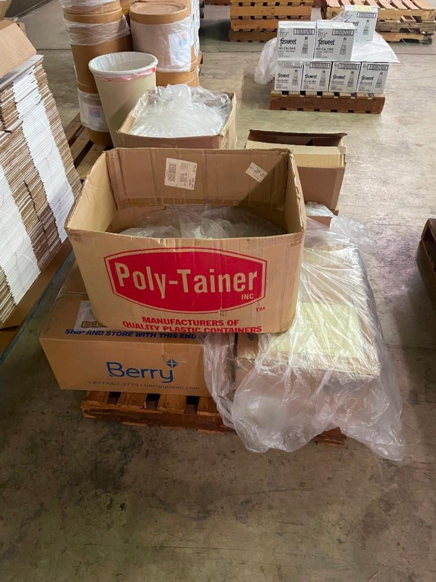 Pallet of Plastic Bottles, Labels, and Caps