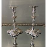 A Pair of George II Cast Silver Candlesticks