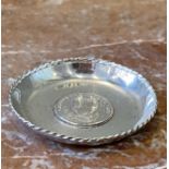 A Set of Continental Sterling Silver Commemorative Coin Dishes