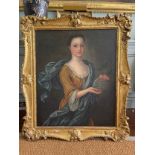 An 18th century provincial English portrait of a Young girl holding grapes. Oil on canvas in a