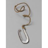 An Oceanic, Tahitian (?) fishhook, strung. 18th Century or earlier.