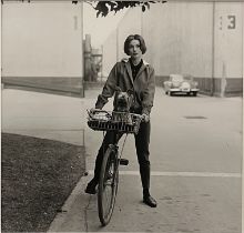 Sid Avery (1918 - 2002), Audrey Hepburn on bike with her dog 'Famous' at Paramount Studios, 1957