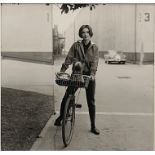 Sid Avery (1918 - 2002), Audrey Hepburn on bike with her dog 'Famous' at Paramount Studios, 1957