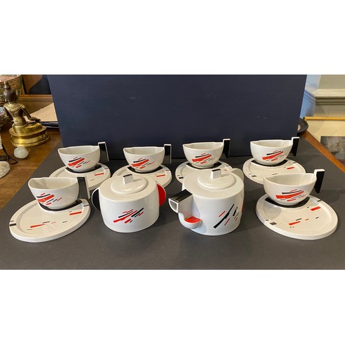 After designs by Nikolai Mikhailovich Suetin (1897-1954), Suprematist teapots, cups and saucers