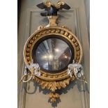 A Regency giltwood convex mirror with crystal sconces
