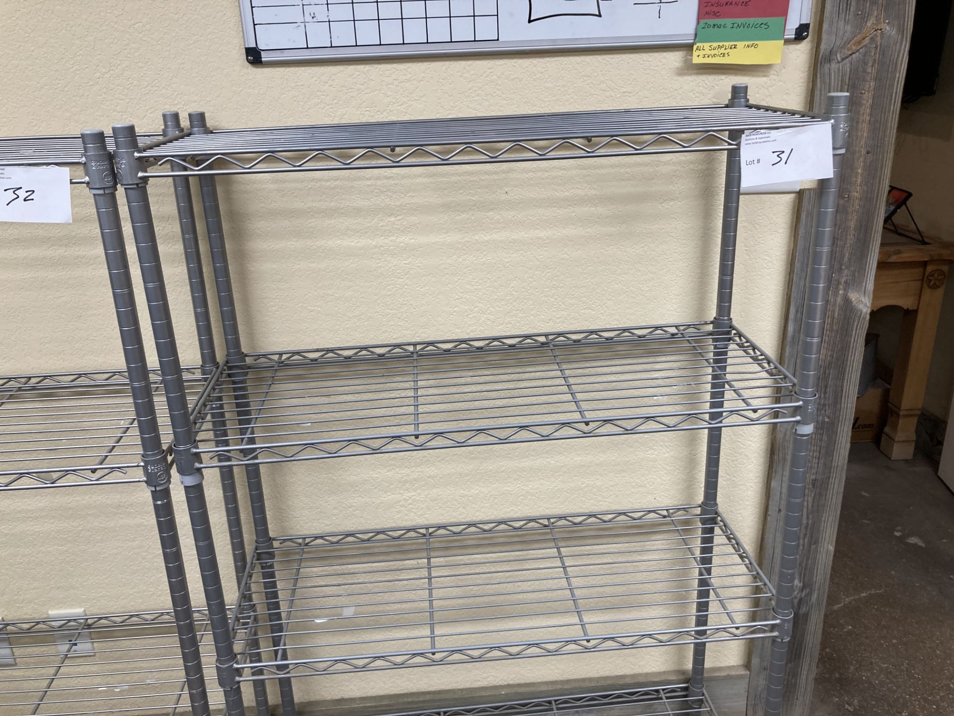 Chrome metal rack with 4 shelves.