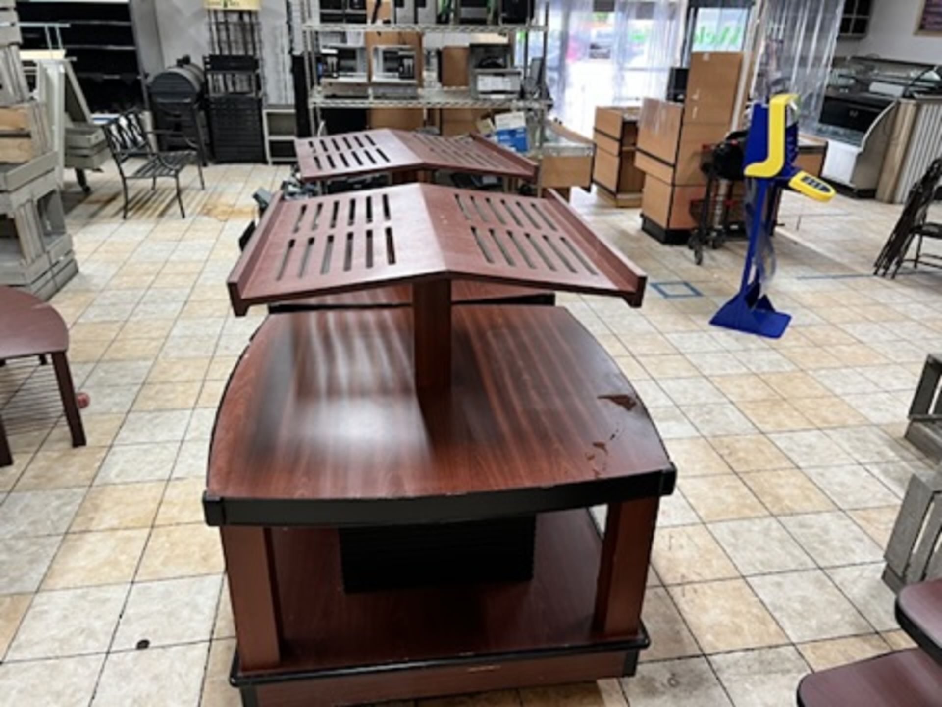 Lot of: (2) approximately 47” X 47” 2 tier wood laminate display tables w/ upper display shelving - Image 7 of 18