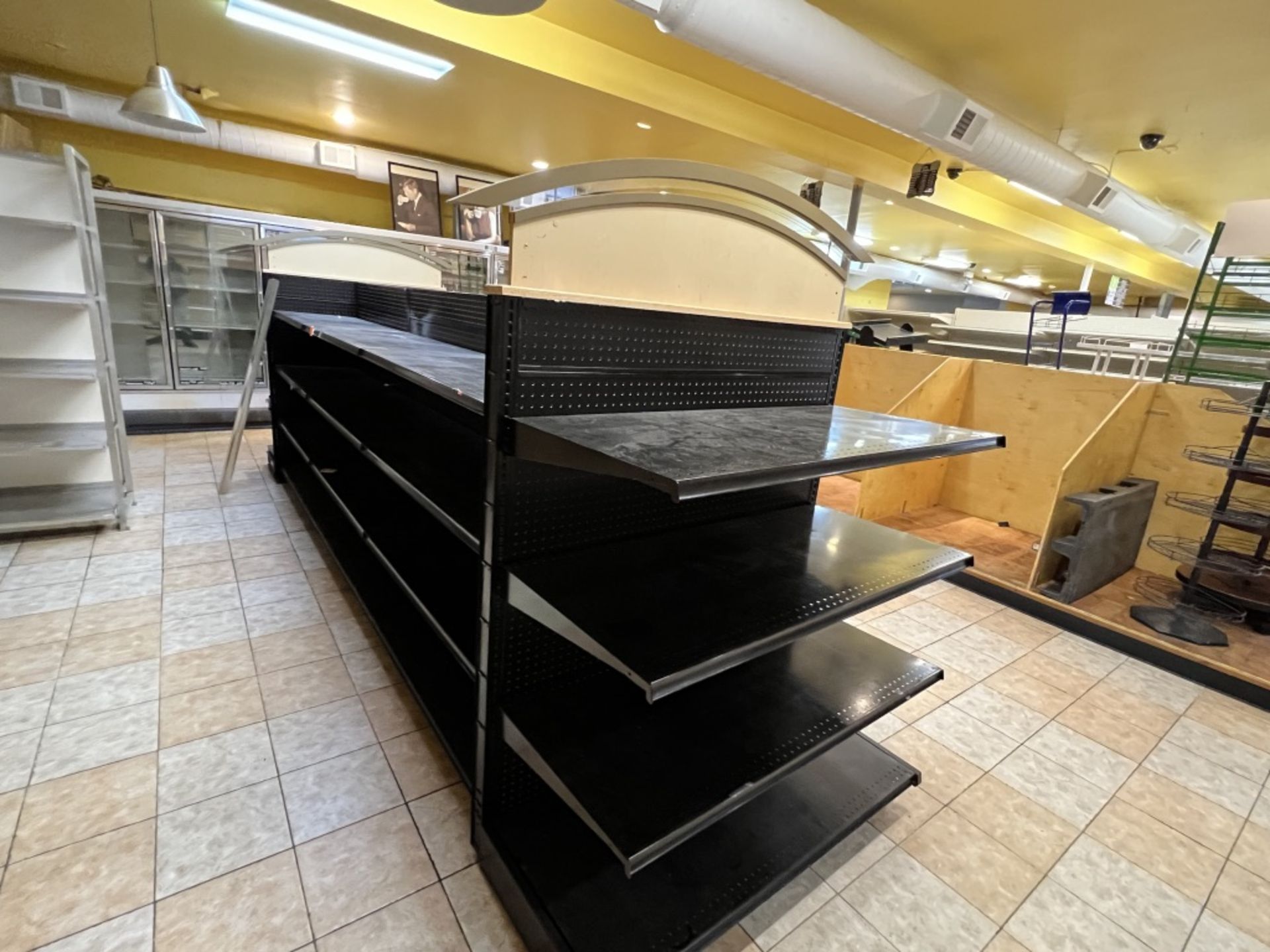 8 Section adjustable Gondola shelving system Approximately 195” Long X 50” Wide with 2 archways o - Image 8 of 12