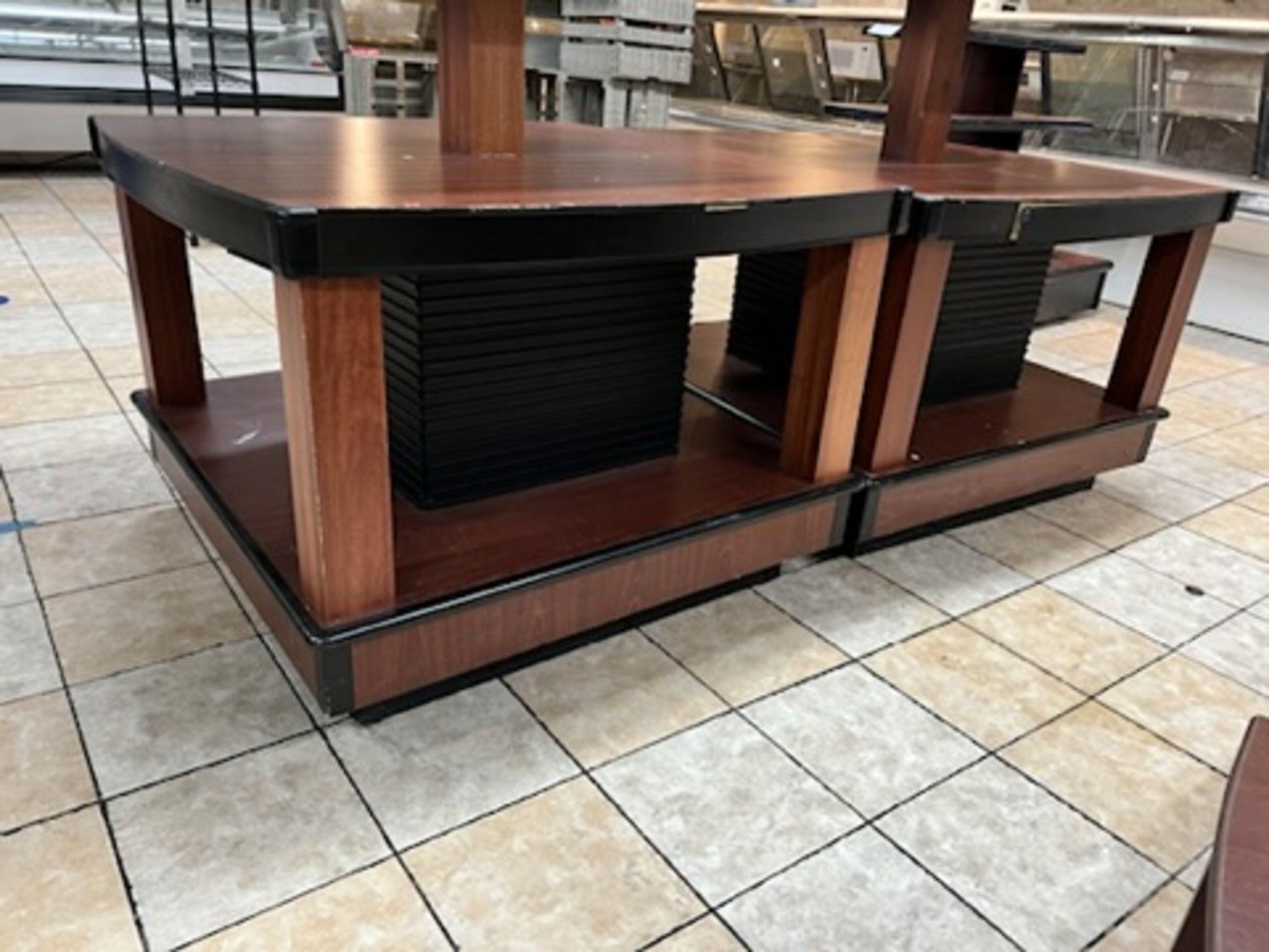 Lot of: (2) approximately 47” X 47” 2 tier wood laminate display tables w/ upper display shelving - Image 15 of 18