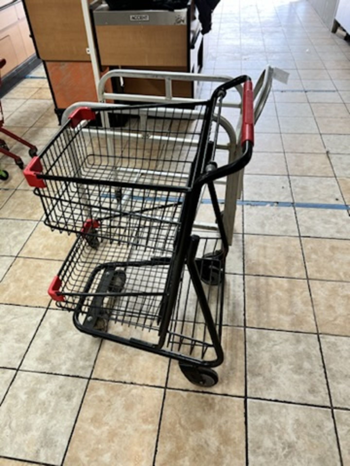 Lot of: (1) silver wheeled cart, and (1) grocery cart