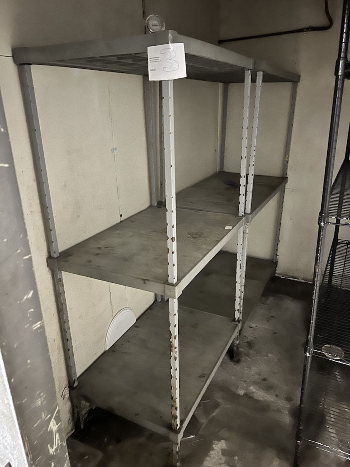 Lot of: (1) 3' wide, 3-tier metal shelving unit and (1) 4' wide, 3-tier metal shelving unit.