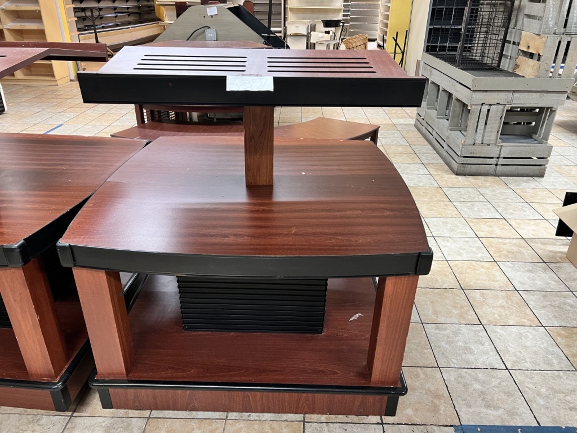 Lot of: (2) approximately 47” X 47” 2 tier wood laminate display tables w/ upper display shelving