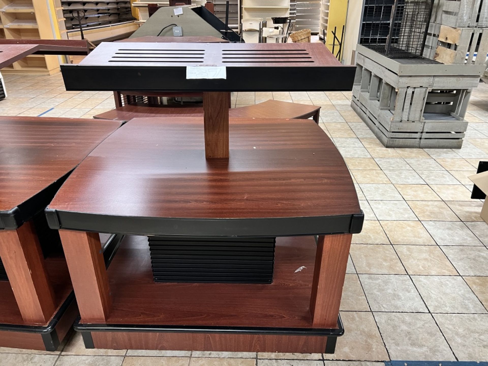 Lot of: (2) approximately 47” X 47” 2 tier wood laminate display tables w/ upper display shelving - Image 2 of 18