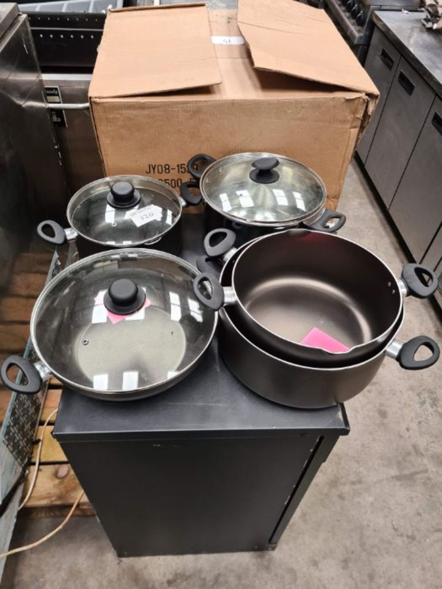 Assorted stock pans and wok.