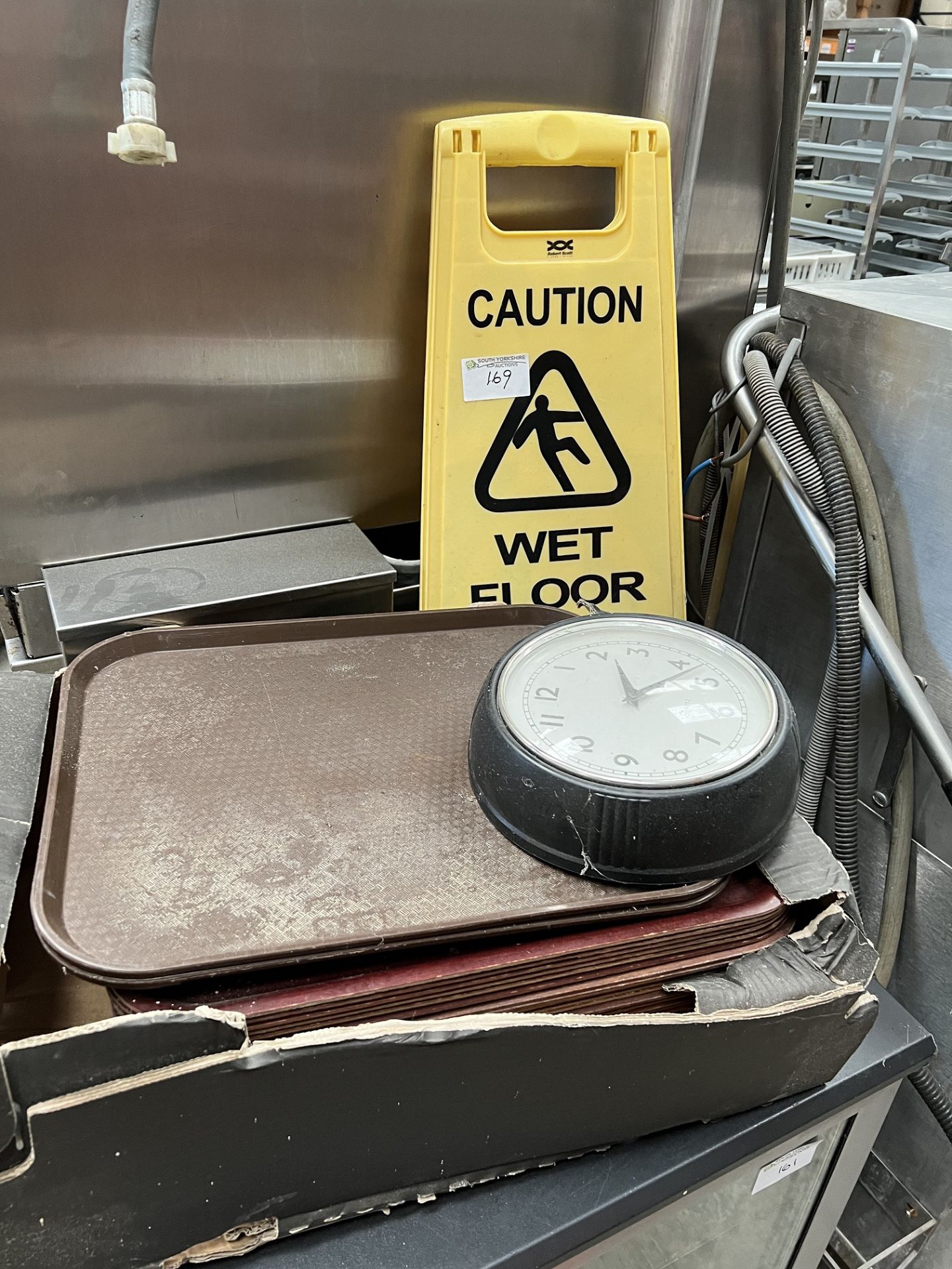 Box of Serving Trays, Clock, Wet Floor Sign
