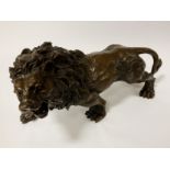 BRONZE LION - APPROX 16 CM (H) X 31 CMS (W) X 10 CM (D)