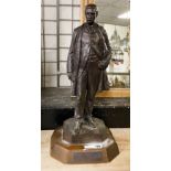 SIGNED BRONZE MAN ON WOODEN BASE - APPROX 57 CMS (H)