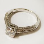 18CT WHITE GOLD HALF CARAT TO THE CENTRE DIAMOND RING WITH ADDITIONAL DIAMONDS TO THE SHOULDER