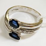 18CT GOLD DIAMOND & SAPPHIRE CROSSOVER RING - SIZE M 4.2 GRAMS APPROX