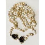 OPERA LENGTH PEARL NECKLACE MARKED 925 SIGNED BY VERD LAOR WITH TWO LARGE SMOKEY QUARTZ STONES