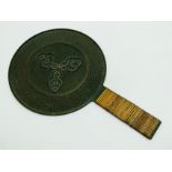 A 19TH-CENTURY JAPANESE BRONZE HAND MIRROR DECORATED TO THE REVERSE WITH A CLAN CREST (MON)