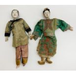 AN UNUSUAL PAIR OF ANTIQUE CHINESE DOLLS ONE WITH "LOTUS" BOUND FEET