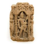 SANDSTONE SECTION DEPICTING A CARVED FIGURE, POSSIBLY A HINDU DEITY WITHIN AN ARCHITECTURAL SETTING