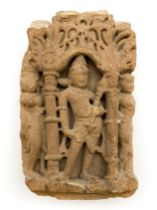 SANDSTONE SECTION DEPICTING A CARVED FIGURE, POSSIBLY A HINDU DEITY WITHIN AN ARCHITECTURAL SETTING