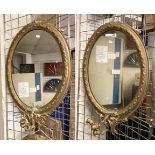 PAIR OF OVAL GILT MIRRORS WITH CANDLE HOLDERS A/F