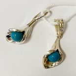 TWO STERLING SILVER TURQUOISE PENDANTS